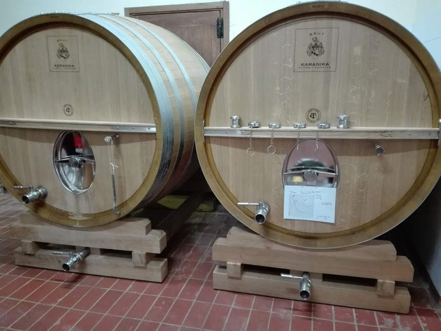 wine wood barrels on the ground at 'Domaine Karanika' cellar